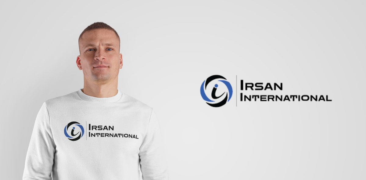Irsan International company logo displayed on a model's white long-sleeve shirt, showcasing corporate branding and identity design.